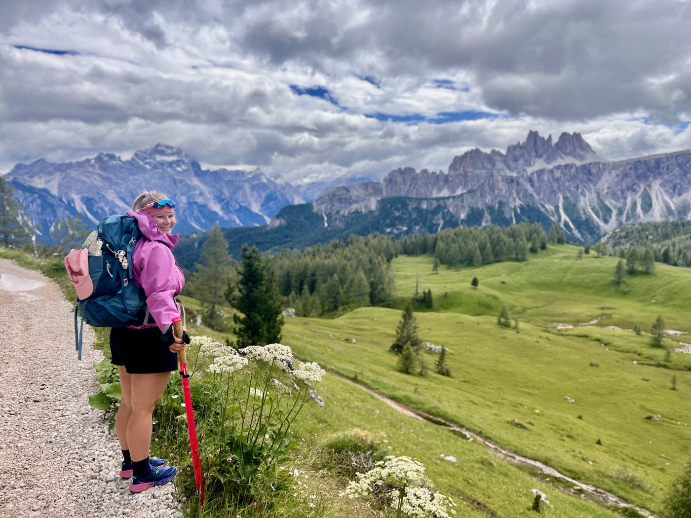 Hiking in the mountains, alpine meadow, dramatic peaks